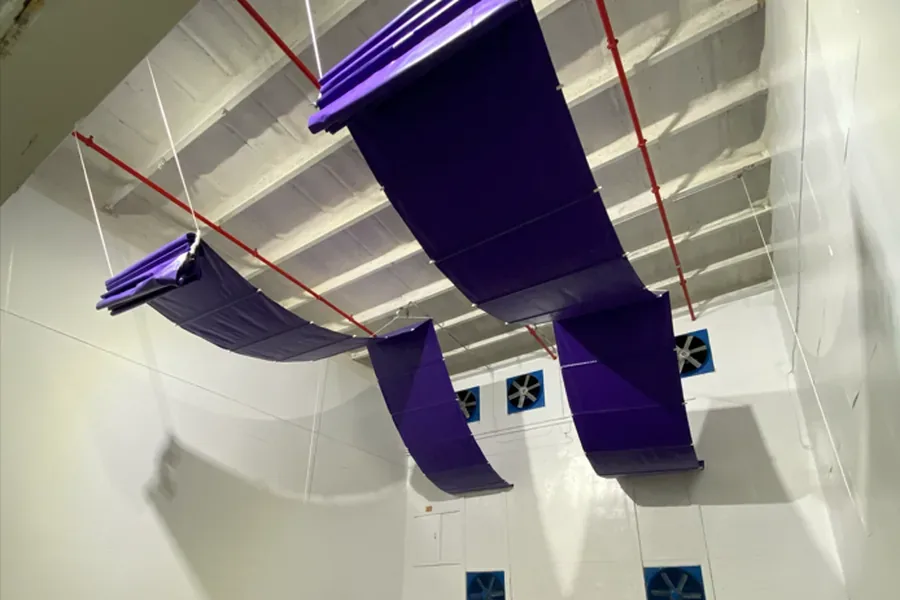 Industrial vinyl curtains and barriers for a commercial facility