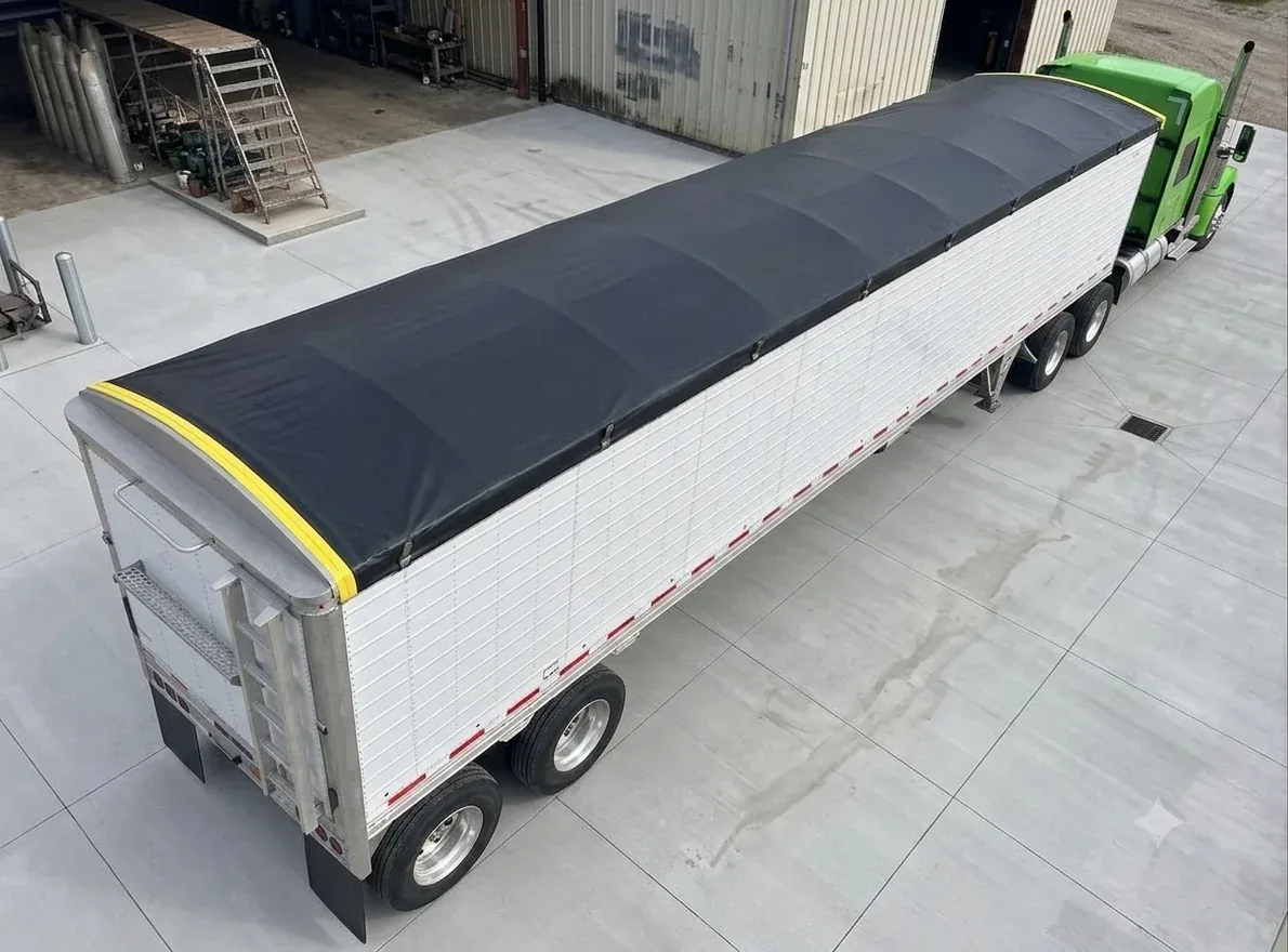 Custom rollover tarp covering an open-top trailer