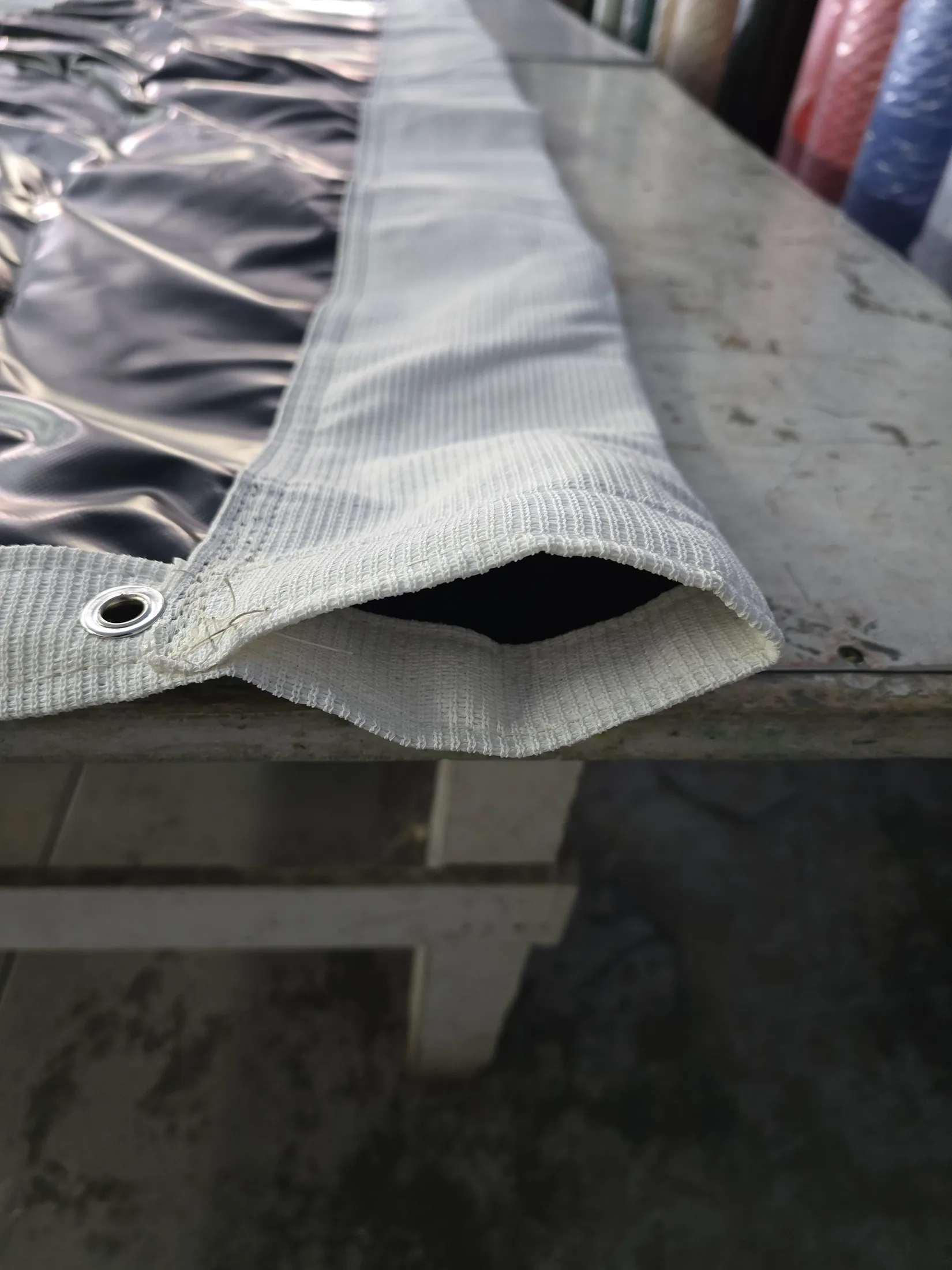 Reinforced side pocket detail on a grape tarp