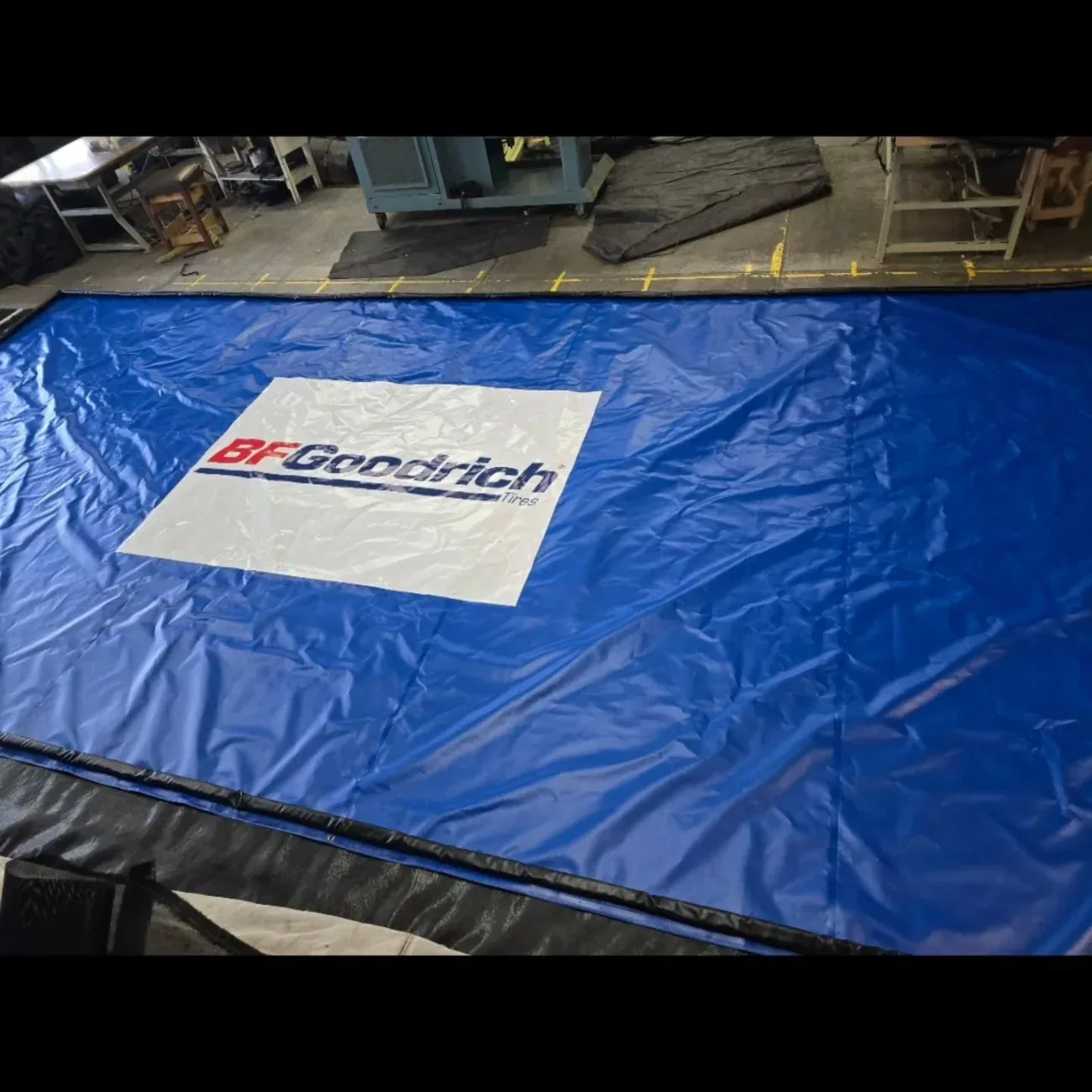 Custom blue off-road racing spill containment mat